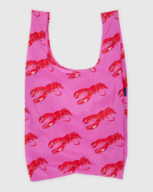 Pink reusable bag with red lobster pattern on a white background