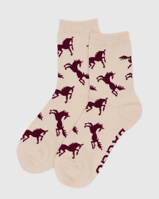 Beige socks with red horse patterns on a light gray background