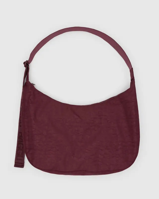 Maroon large crossbody bag on a white background