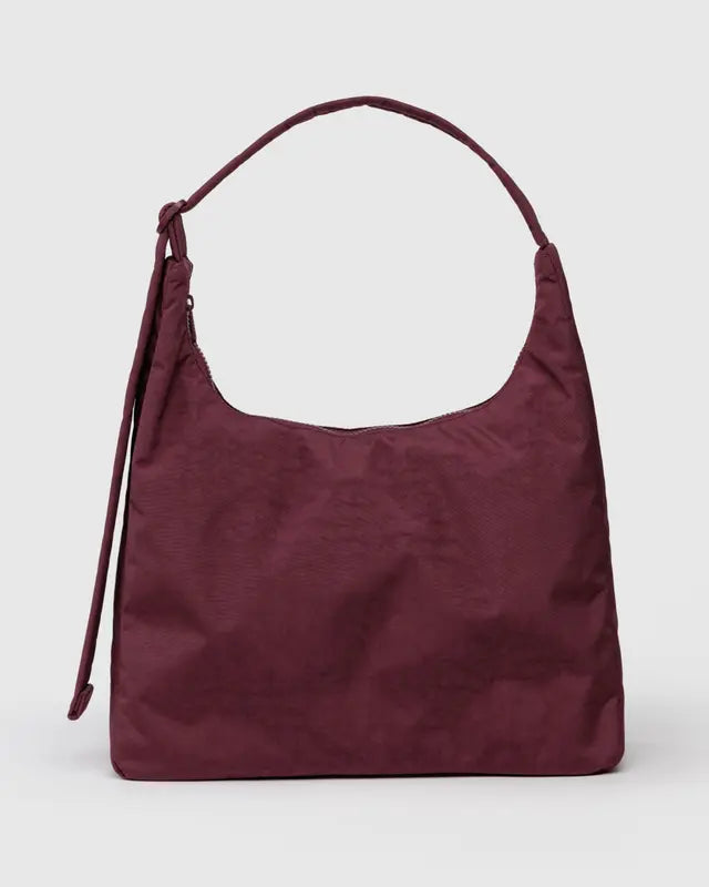 Maroon handbag on a light gray background