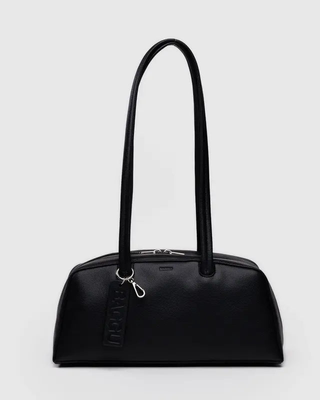 Black bowler handbag with a strap on a light gray background