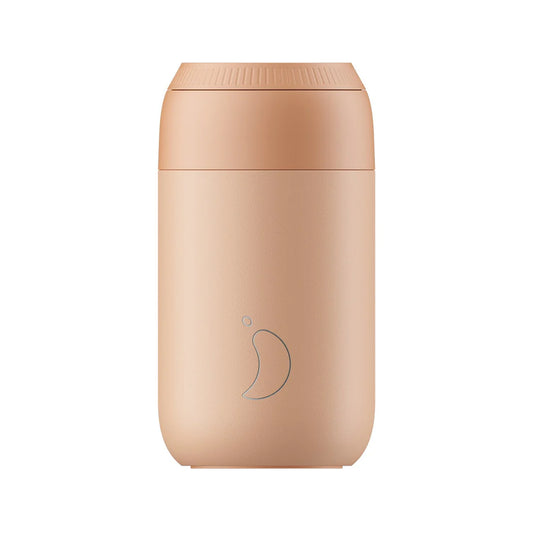 a peachy orange coloured travel mug