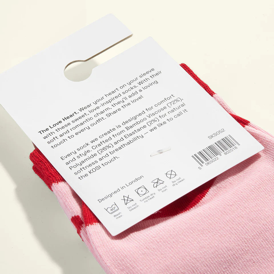 Pink socks with a label on a light background