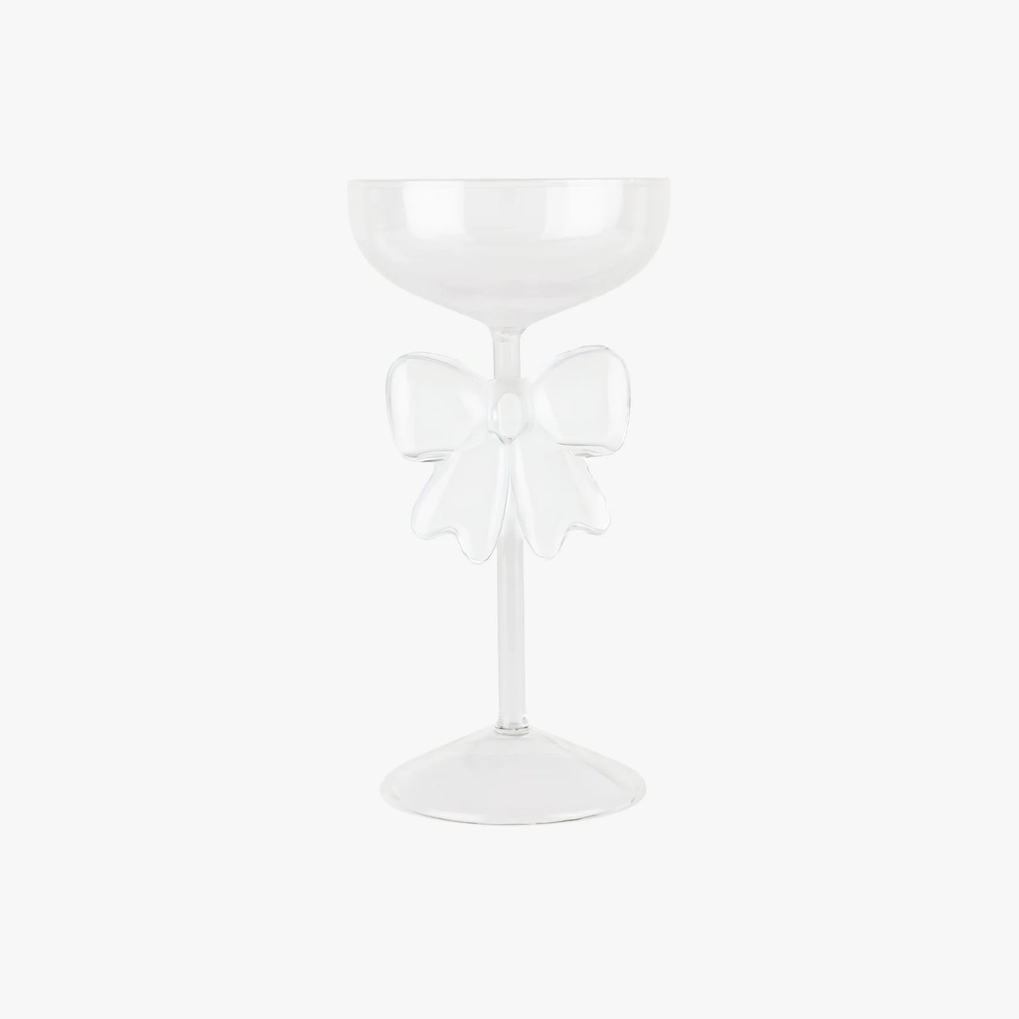 White glass with a decorative bow on a white background