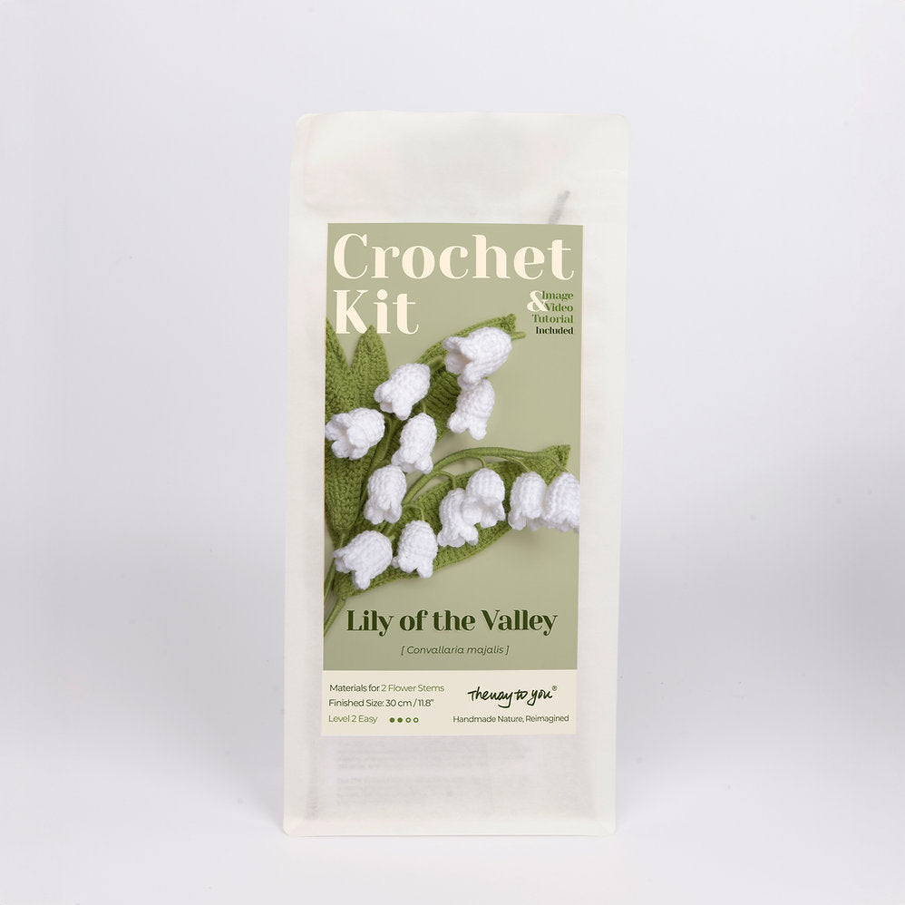 Crochet kit packaging with 'Lily of the Valley' design on a light gray background