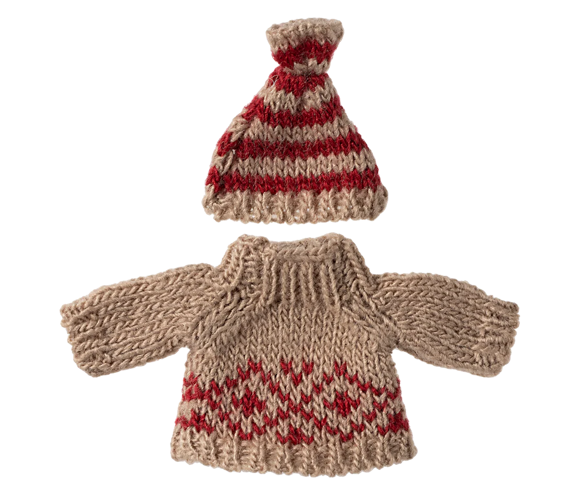 Knitted sweater and hat set with red and beige pattern on a white background