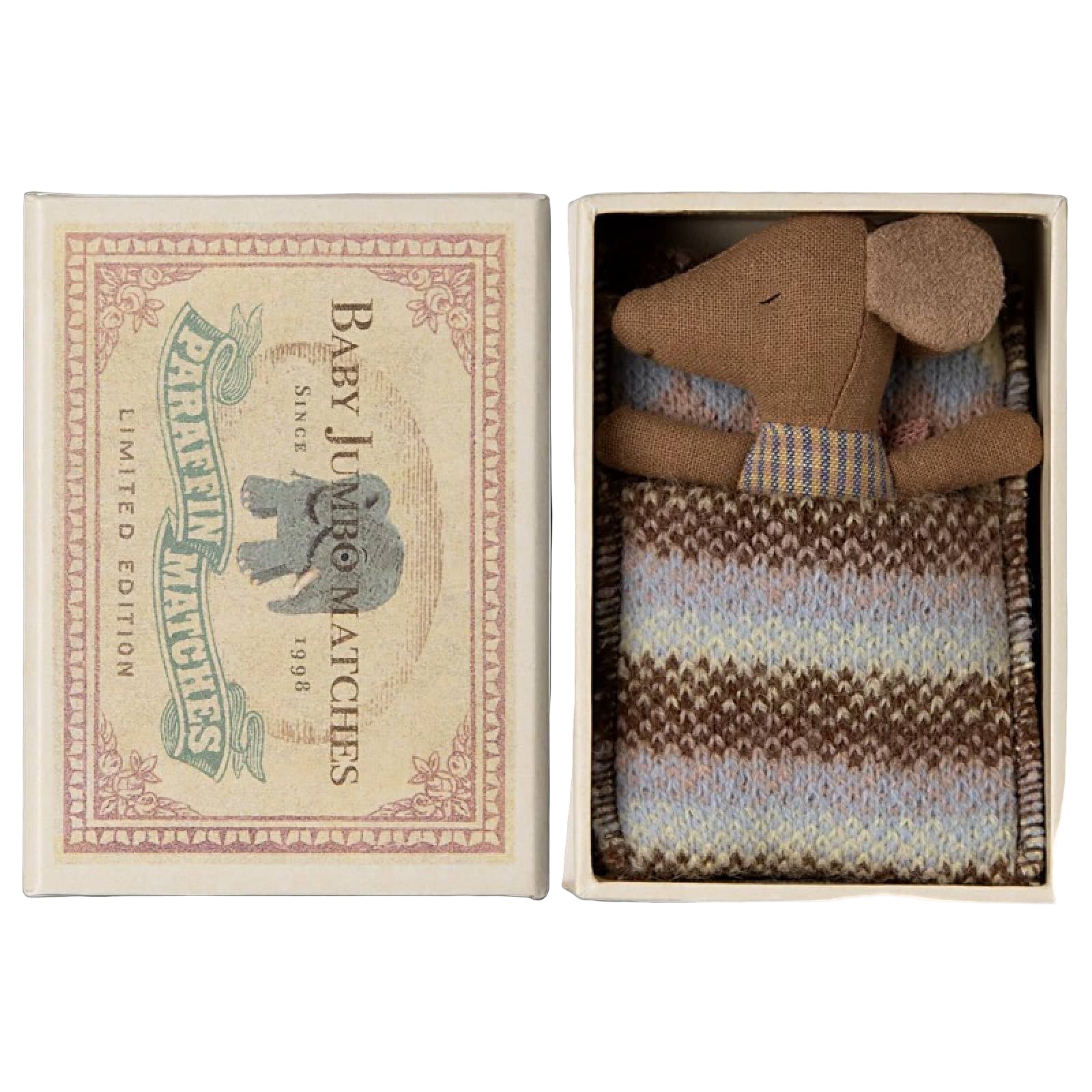 Small teddy bear in a matchbox with a vintage matchbox labeled 'Baby Jumbo Matches'.