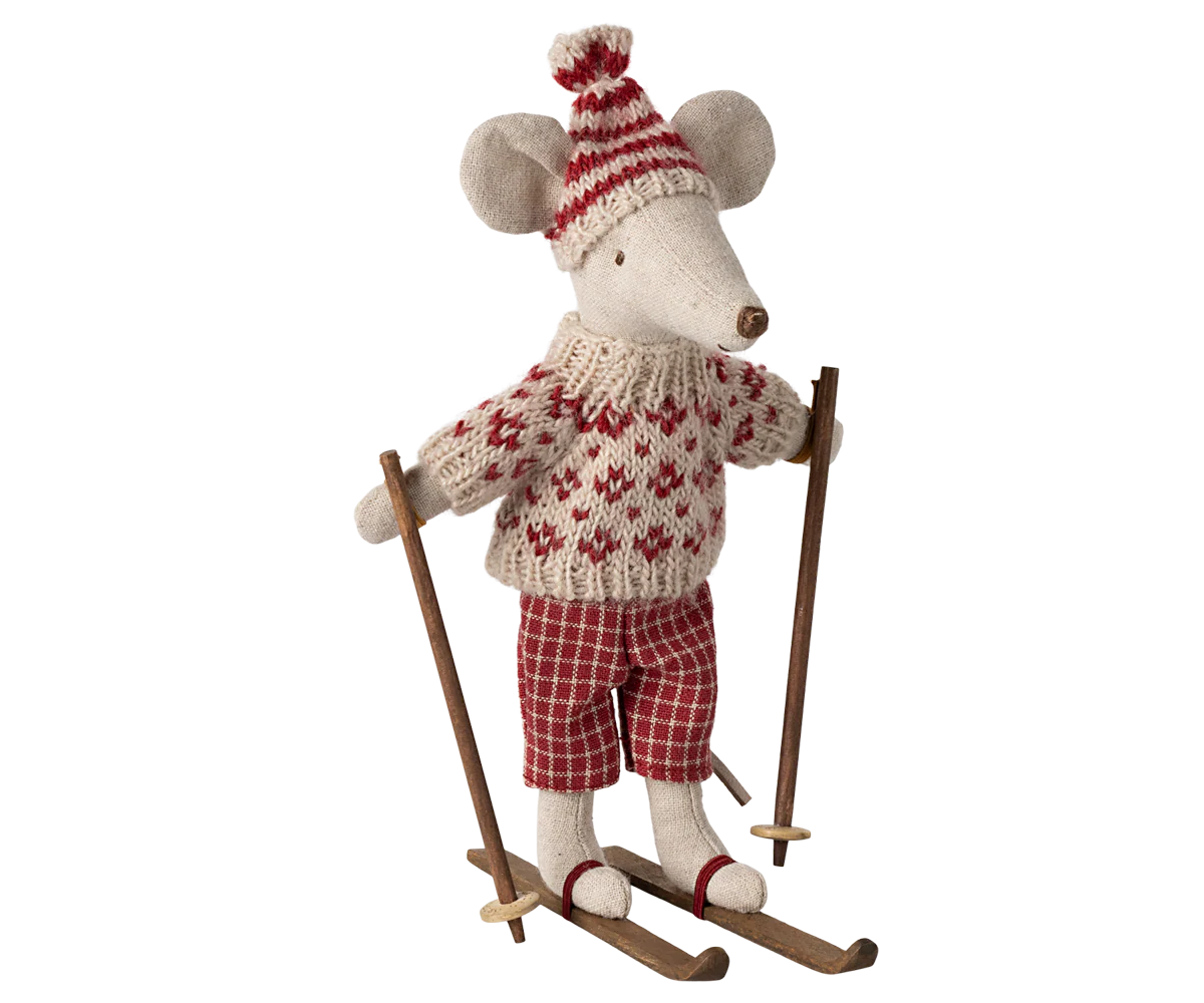 Decorative mouse figure wearing a sweater, hat, and skis on a white background