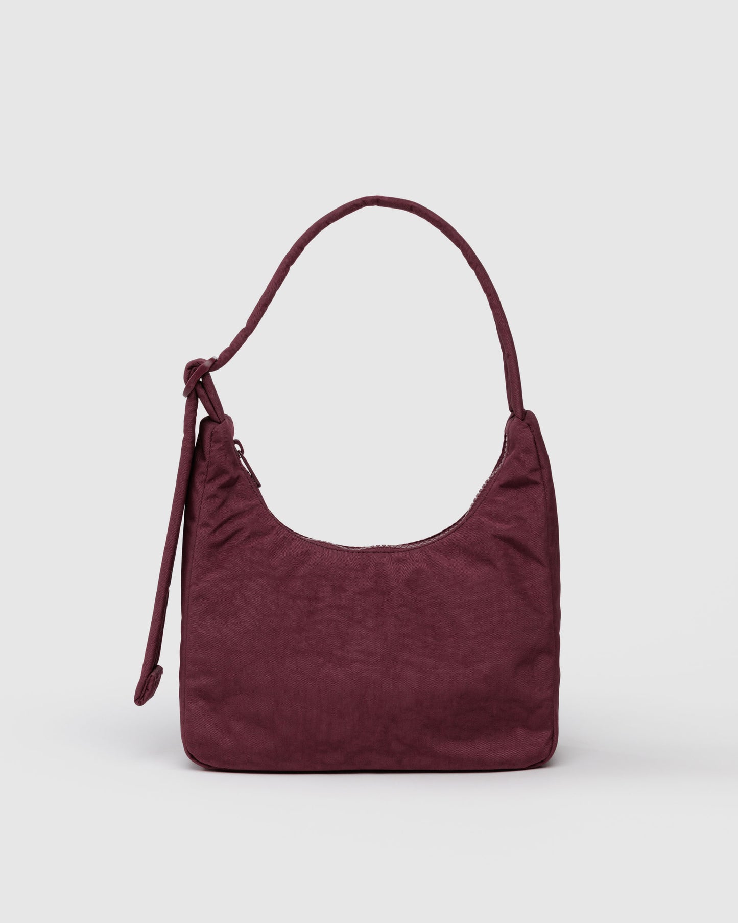 Maroon handbag on a light gray background