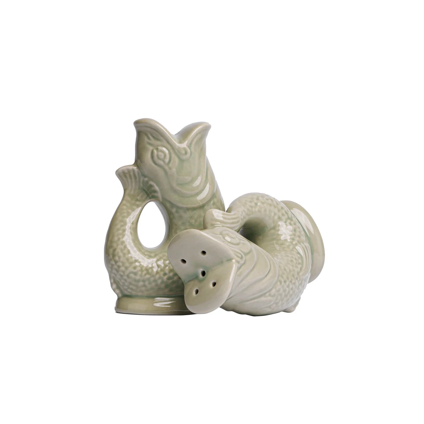 Decorative salt and pepper shakers with fish design on a white background