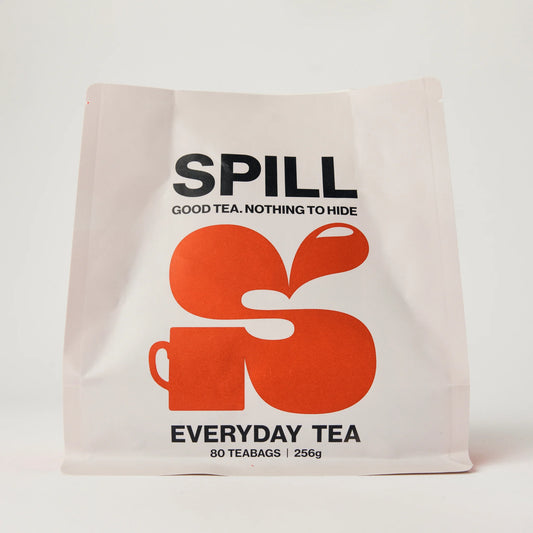 Tea bag packaging with 'SPILL' branding on a white background