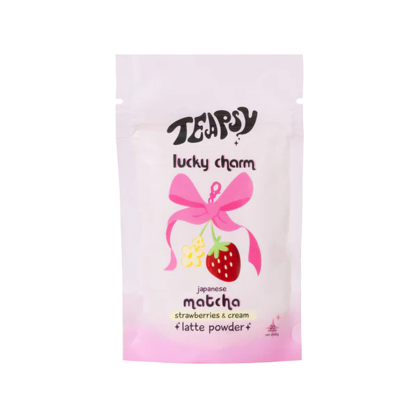 Tea bag packaging with a pink bow and strawberry illustration on a white background