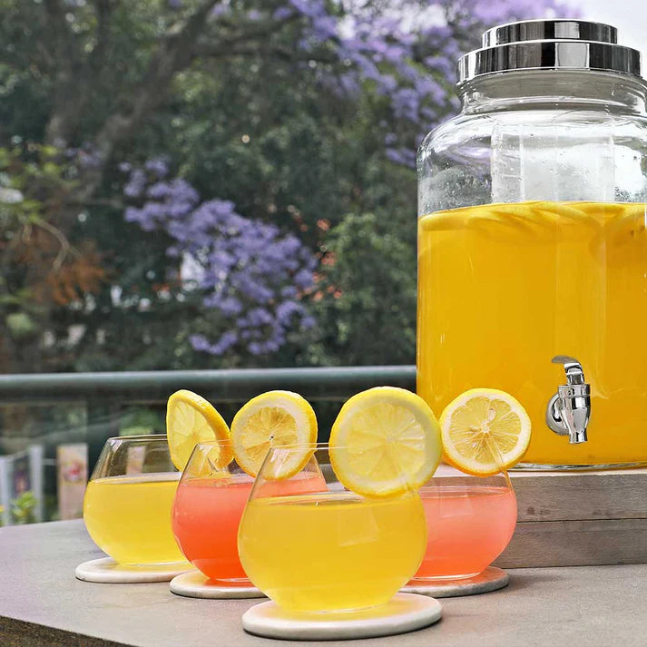 lifestyle image of tumblers with juice