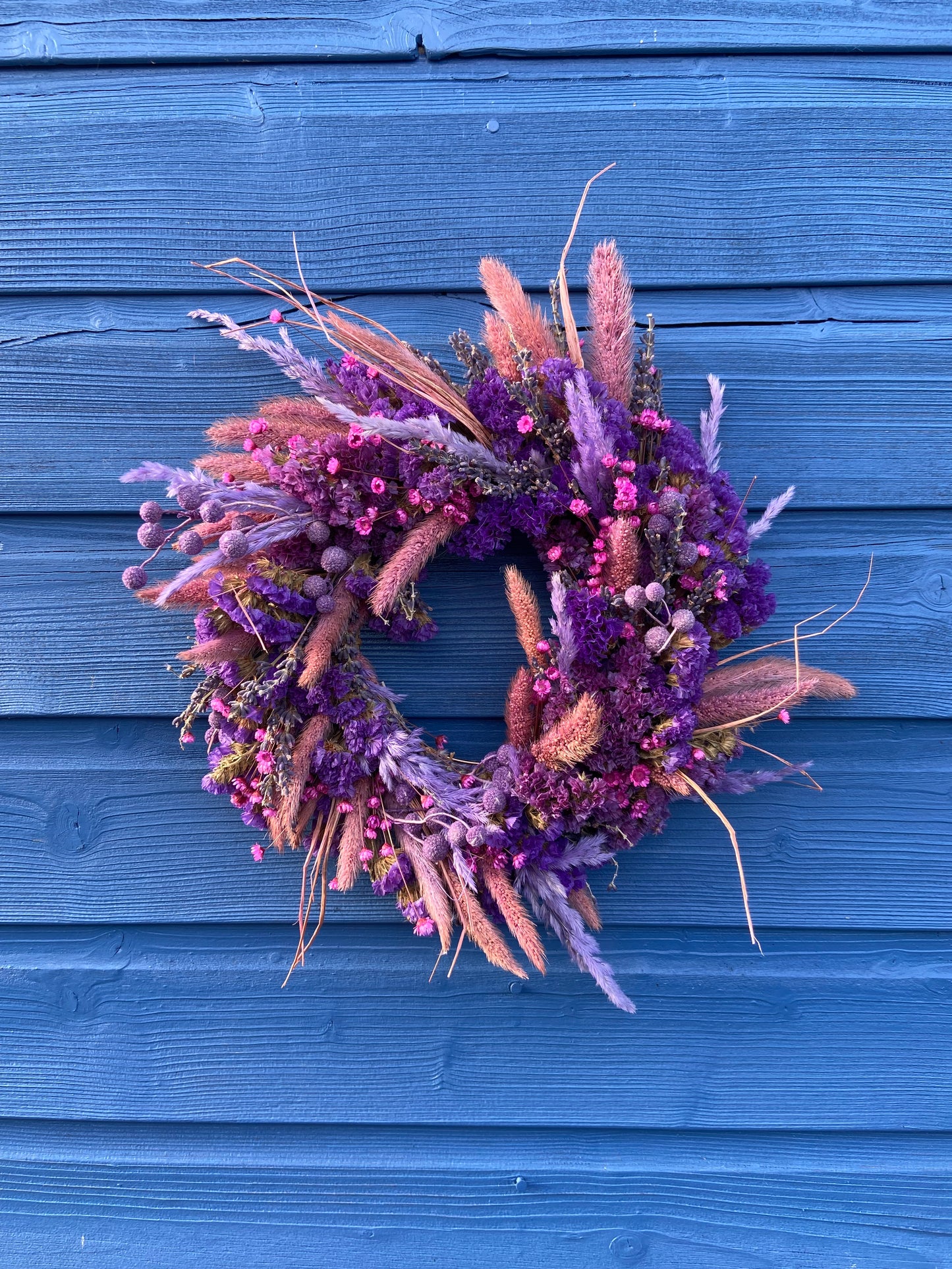 Modern Christmas Door Wreath made form beautiful purple and pink dry flowes.