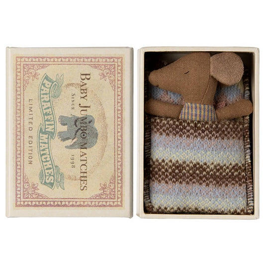 Small mice in a matchbox with a decorative label