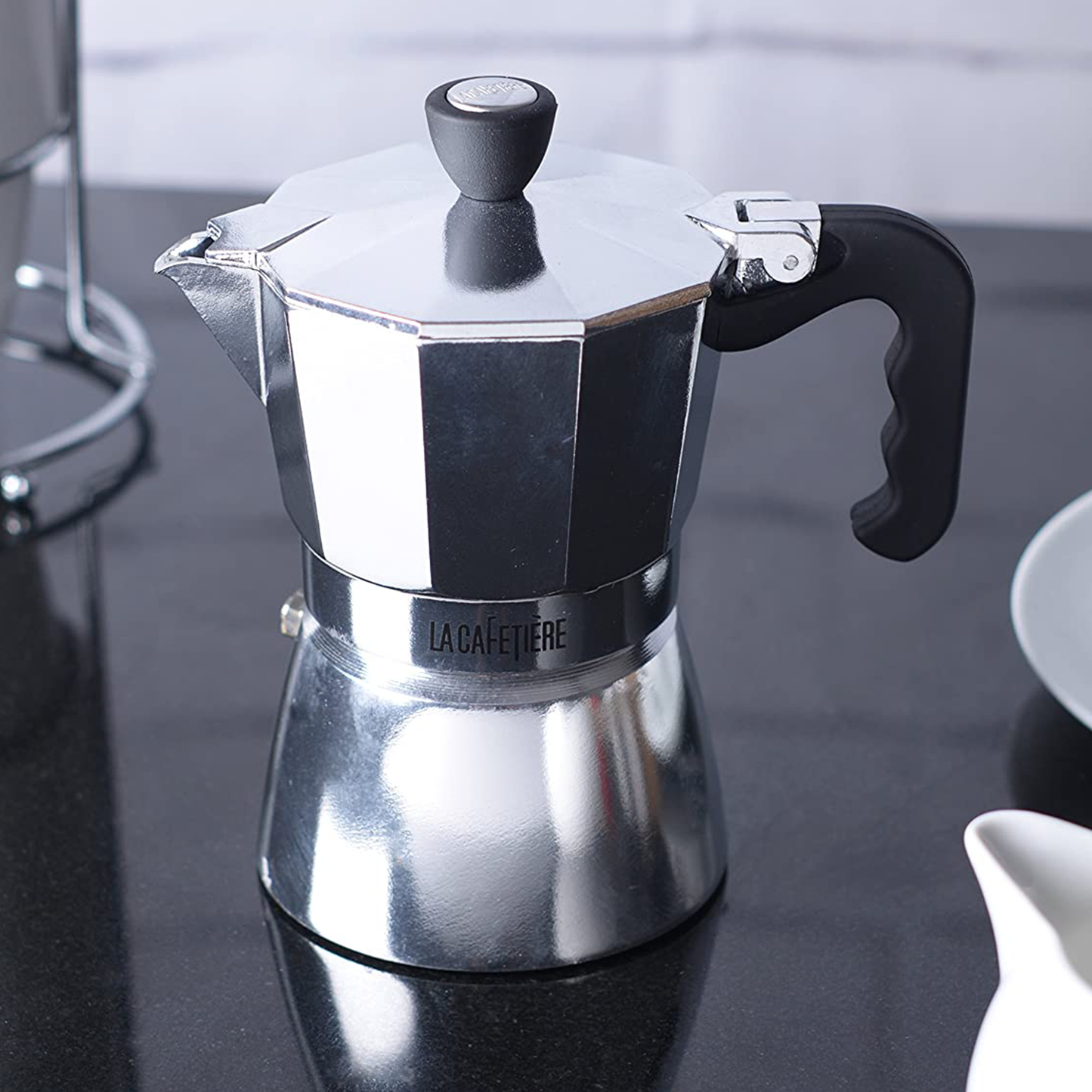 the espresso maker on a kitchen counter