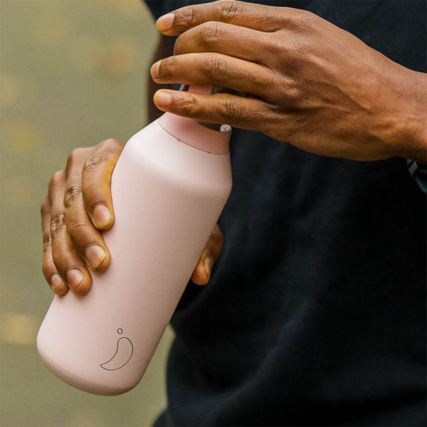 a man opening the bottle