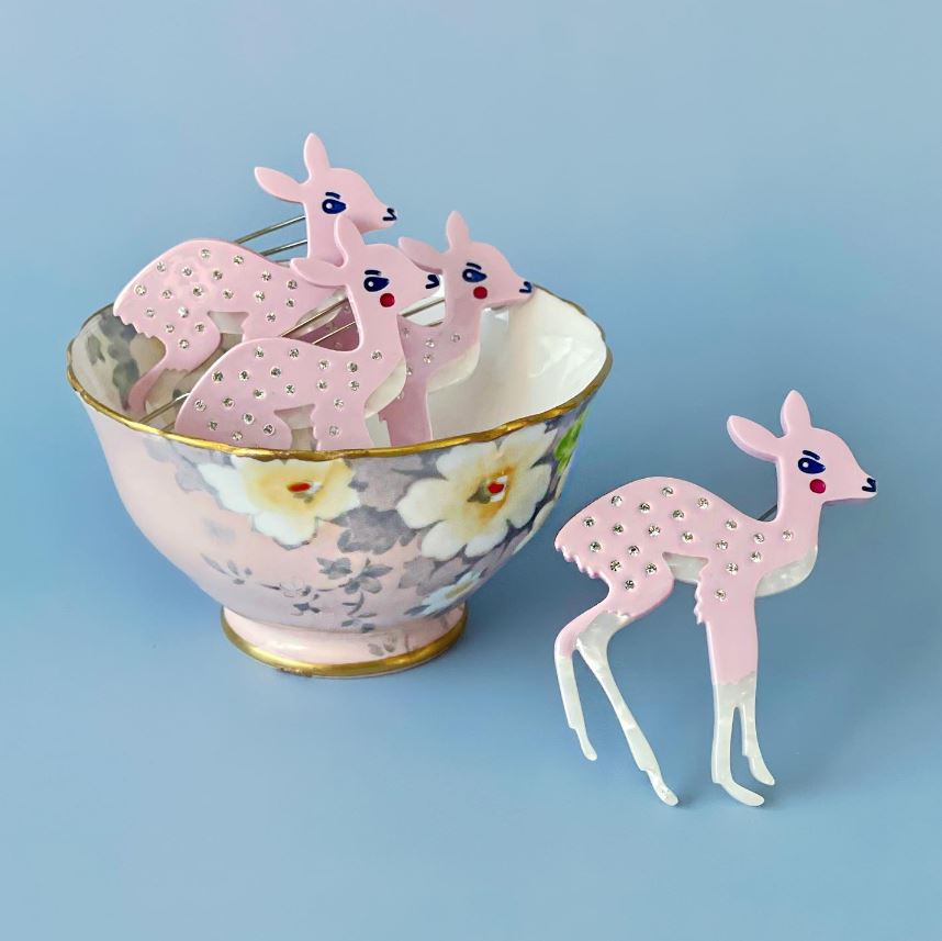 deer hair clips displayed in a tea cup on a blue background