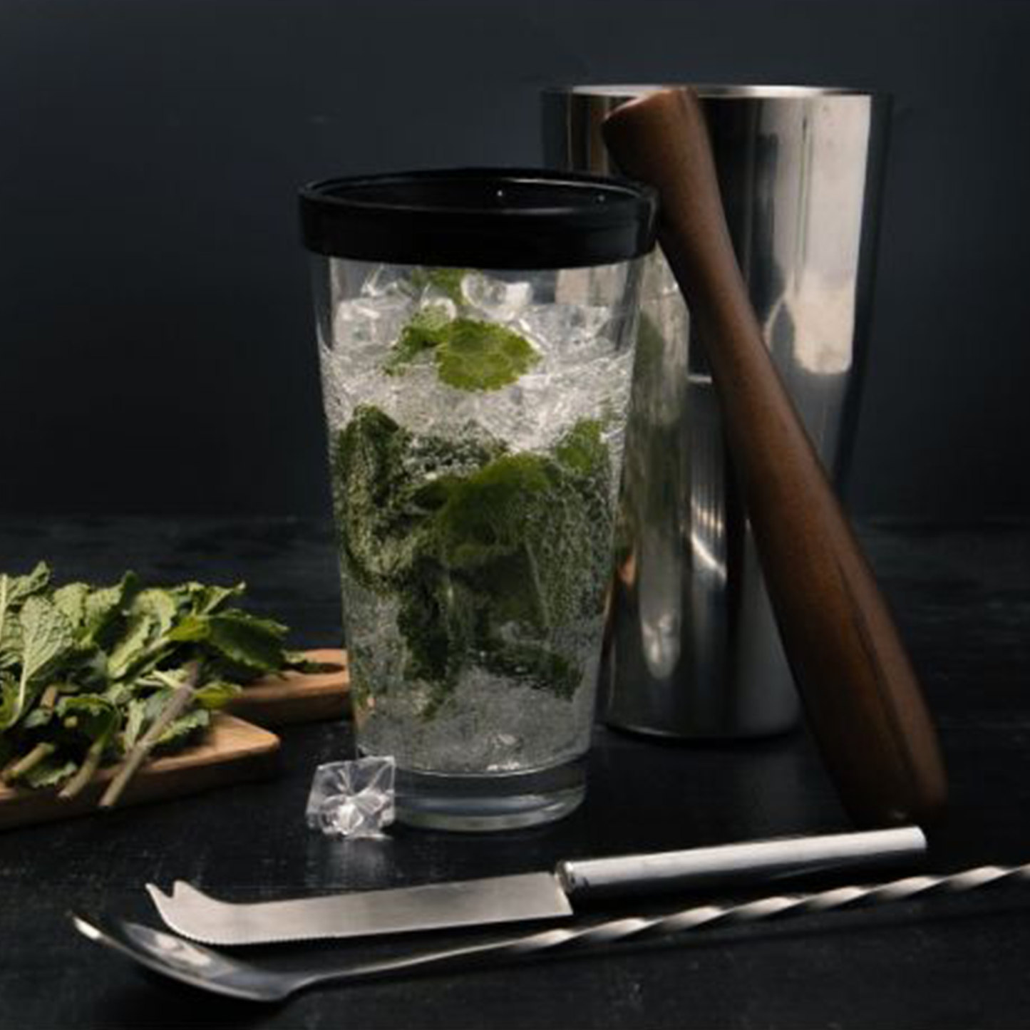 the glass tumbler ready to shake a mojito