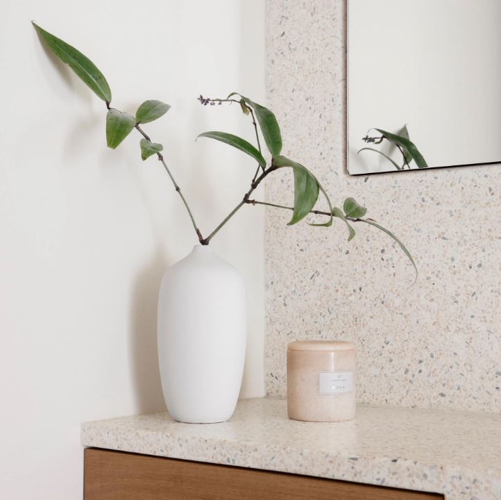 cream marble candle and white vase
