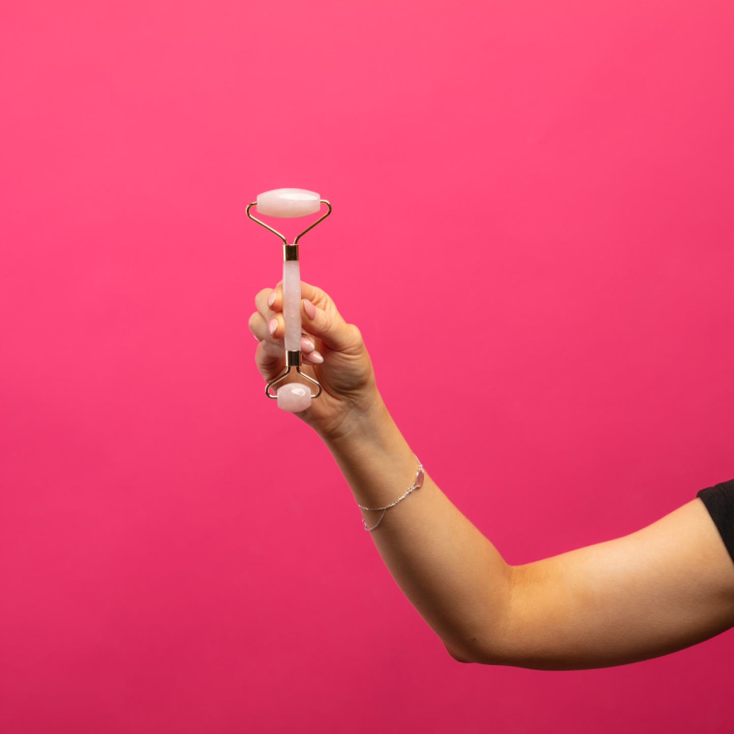a woman holding the roller up in the air