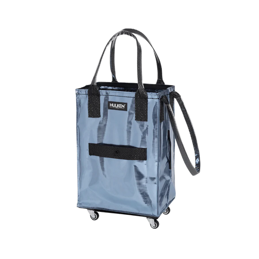 Blue shopping cart bag with black handles and wheels on a white background