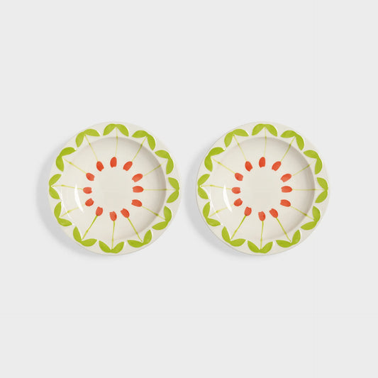 Two decorative plates with floral patterns on a white background