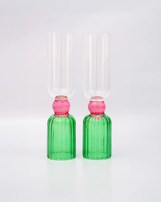 set of 2 flute glasses with green and pink detailing. 