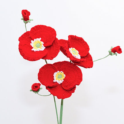 three crochet flowers poppy