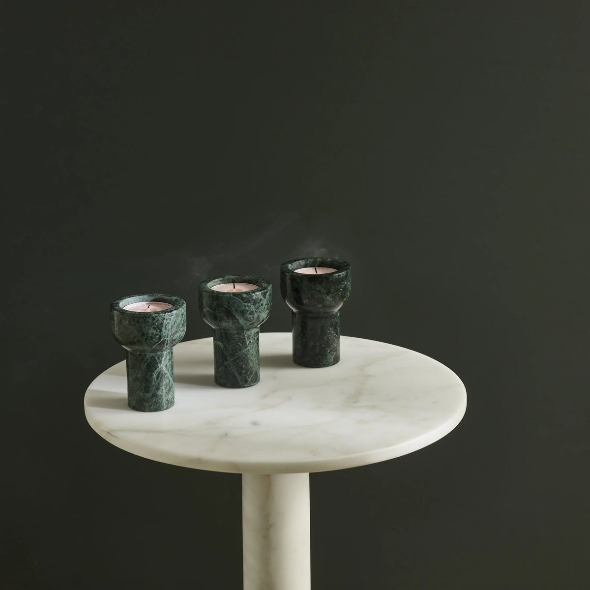 Aaron Probyn Como Tealight & Taper Candle Holder in Forest Green on a dark background 