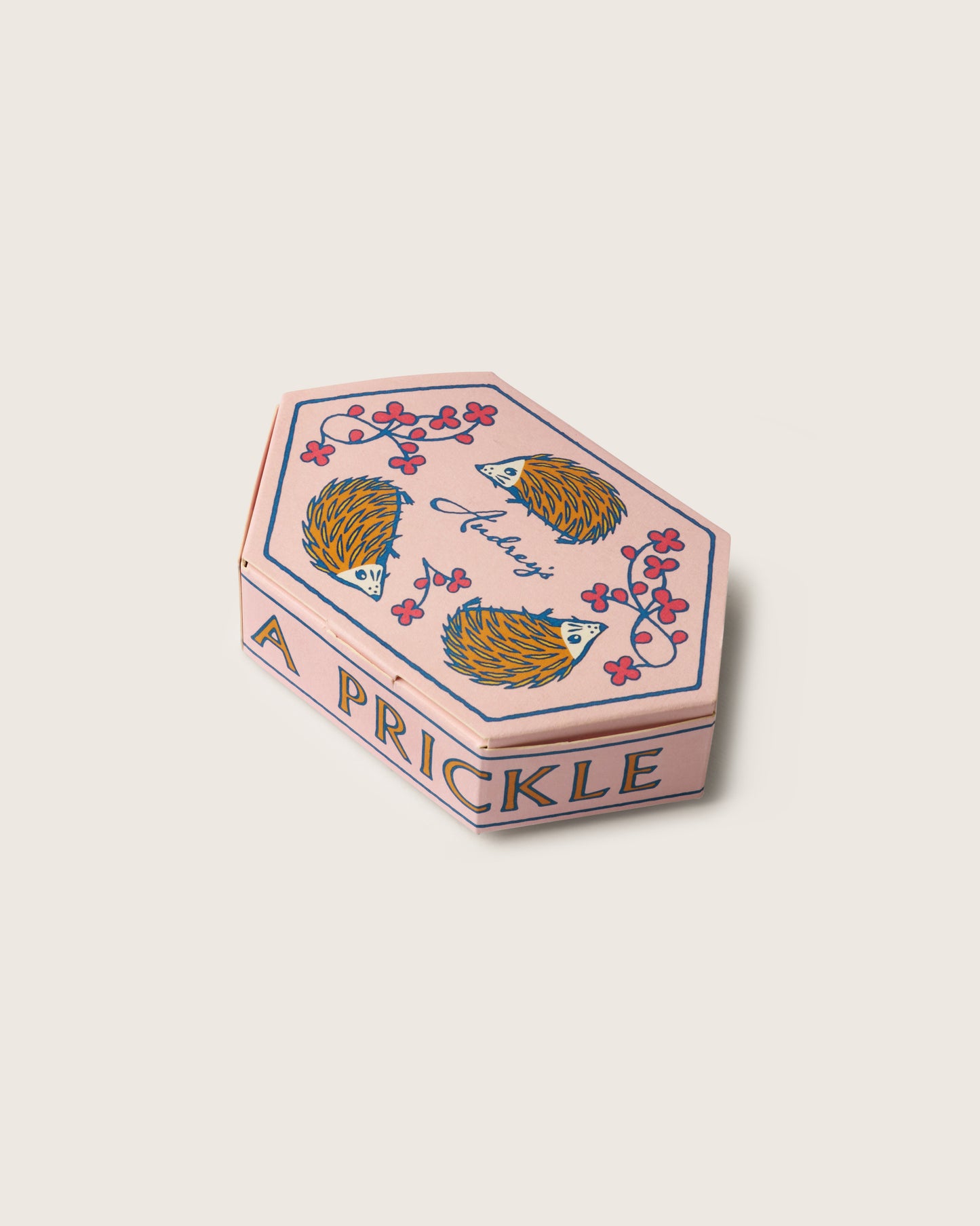 A pink box featuring hedgehogs  illustration on a white background
