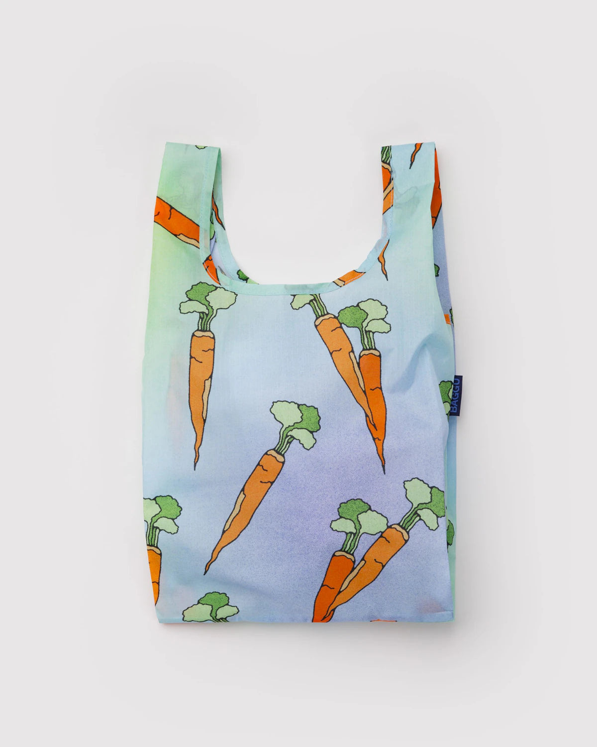 Reusable shopping bag with carrot pattern on a light blue background
