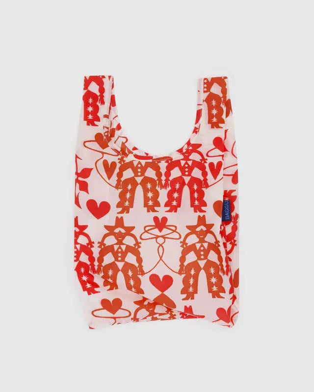 Reusable shopping bag with red cowgirl patterns on a white background