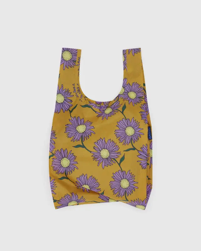 Reusable bag with purple floral pattern on a mustard yellow background
