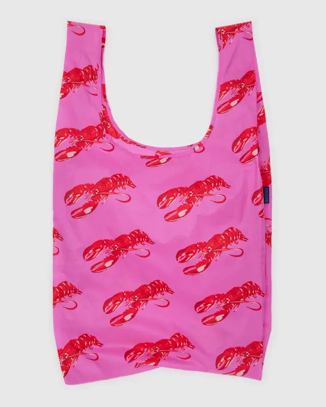 Pink reusable bag with red lobster pattern on a white background