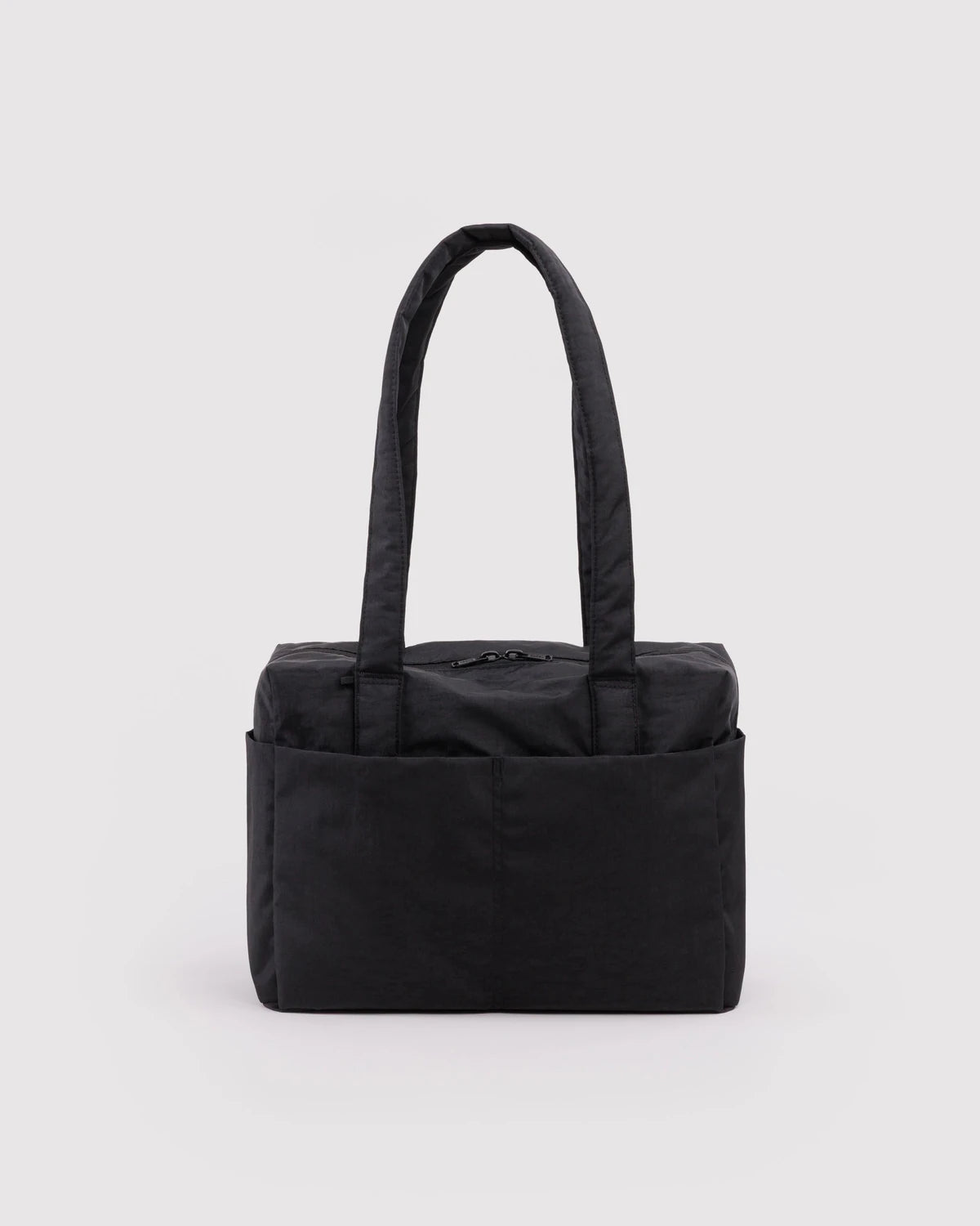 Black tote bag on a light gray background