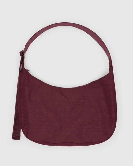Maroon large crossbody bag on a white background
