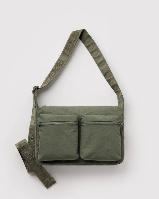Green shoulder bag with multiple pockets on a white background