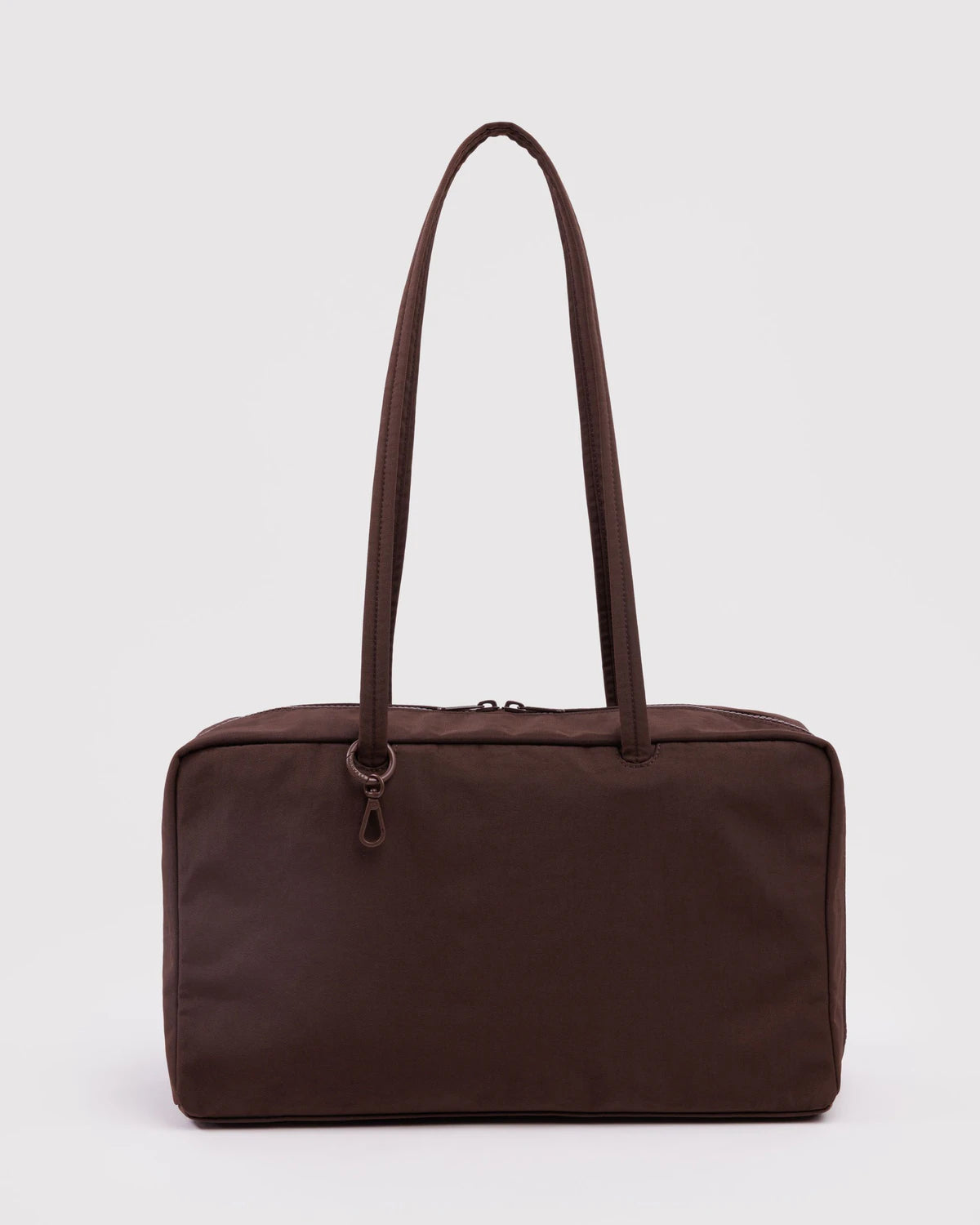 Brown handbag with a strap on a light gray background