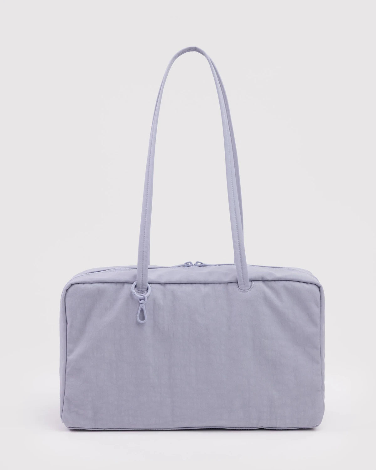 Light gray/lilac  handbag with a strap on a light gray background