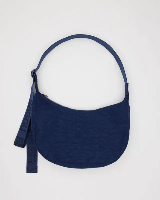 Navy Blue Crescent bag with a navu blue strap made from nylon material.