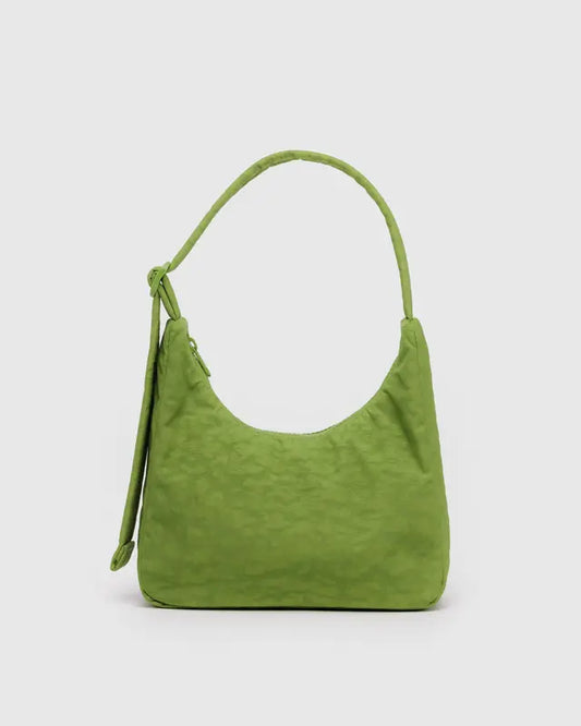 Green handbag on a light gray background