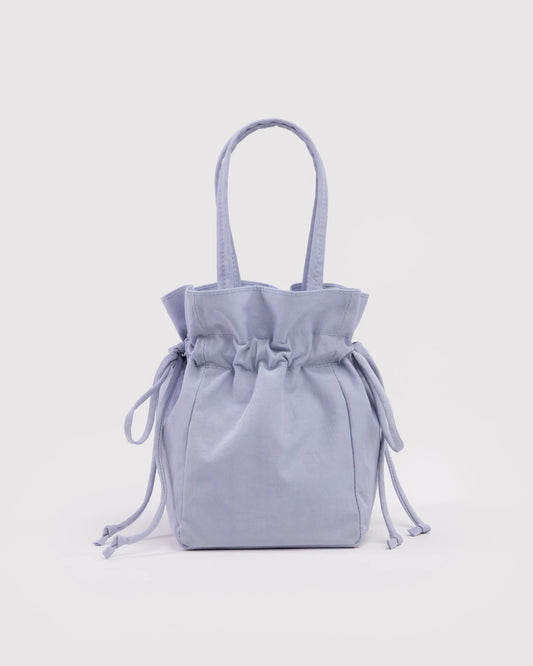 Light blue drawstring bag on a light gray background