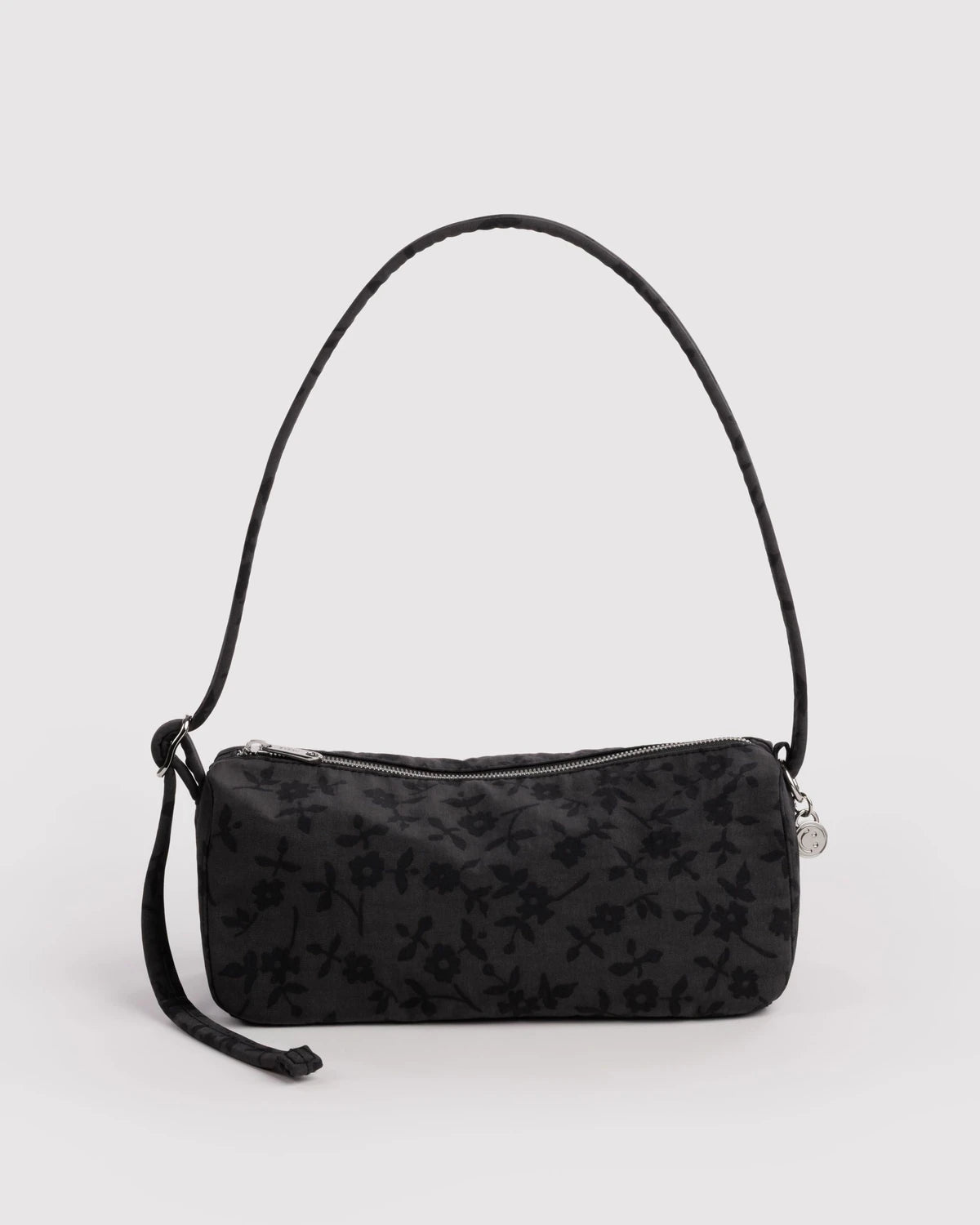 BAGGU Nylon Loaf Bag in Charcoal Ditsy Floral pattern on a grey background 