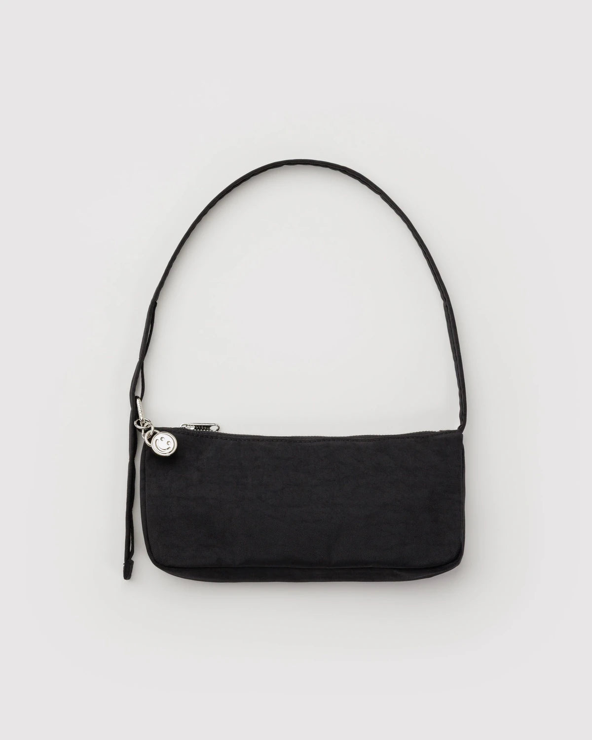 Black shoulder bag on a light gray background