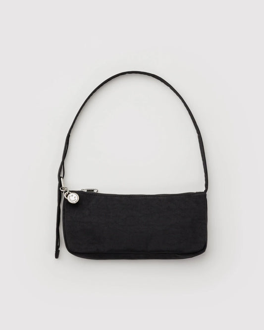 Black shoulder bag on a light gray background
