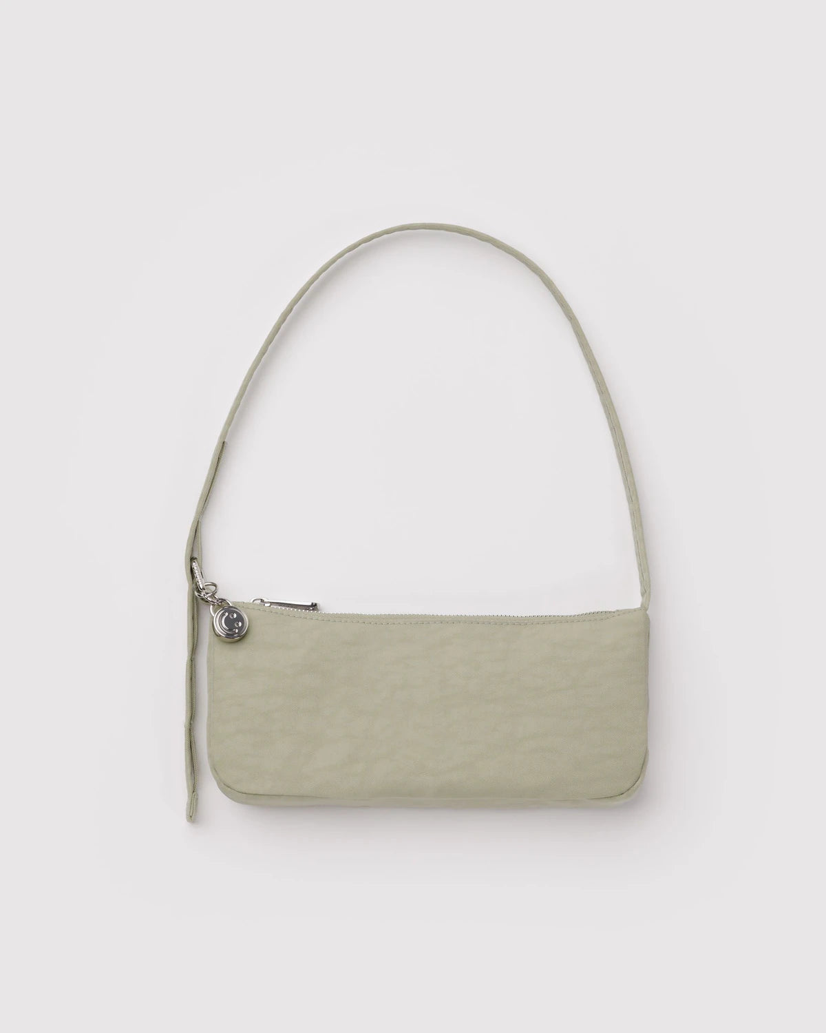 Two-toned handbag with a white top section and beige bottom section on a light gray background
