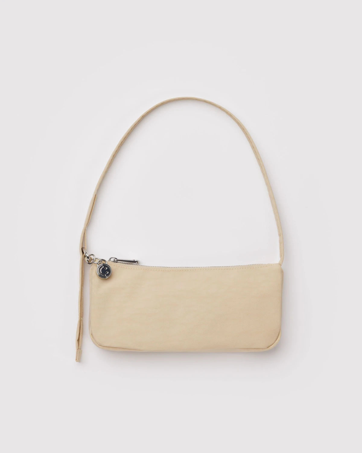 Cream handbag with a strap on a white background