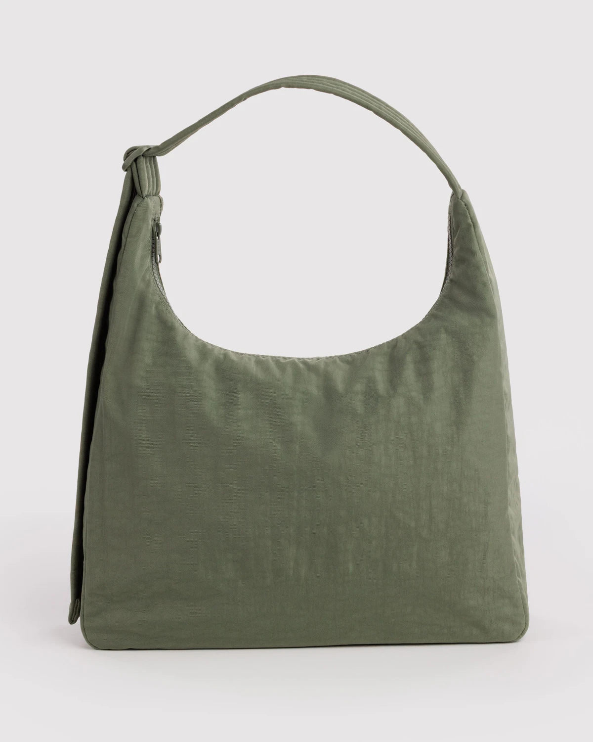 Green handbag on a light gray background