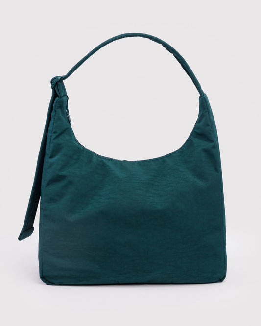 Green handbag on a light gray background